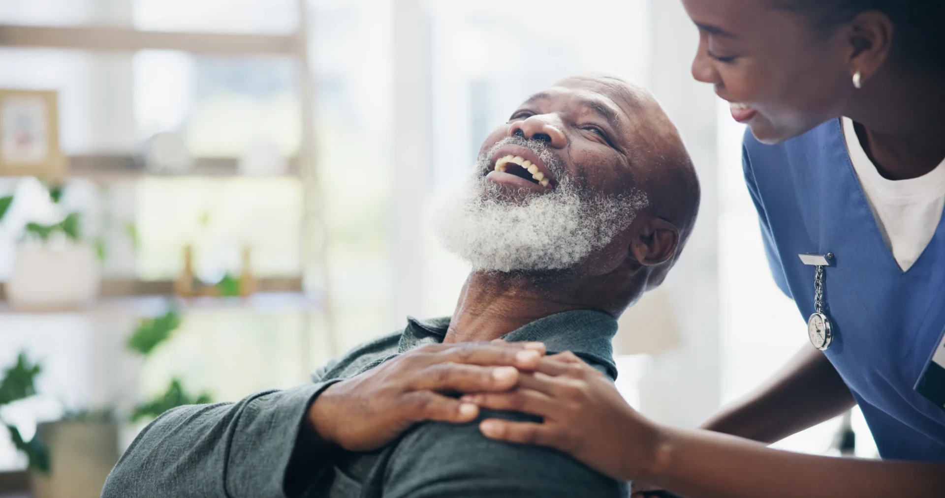 A caregiver supporting an older adult, reflecting the care and community at the heart of INSPIRE